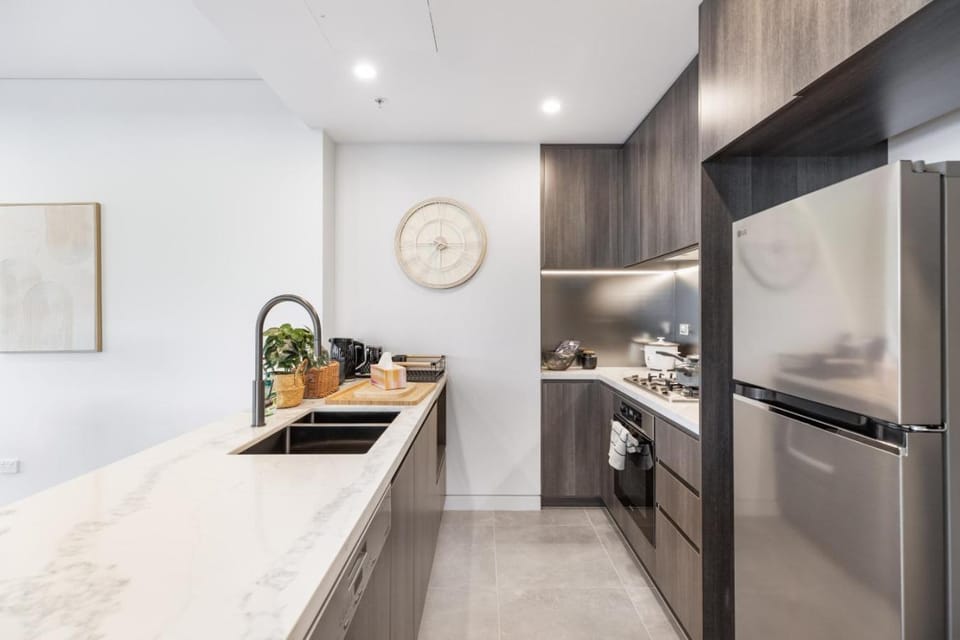 Kitchen or kitchenette, dishwasher, oven, stove