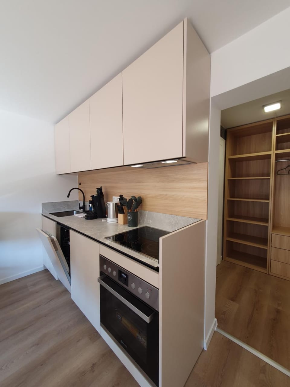 Kitchen or kitchenette, dishwasher, oven, stove
