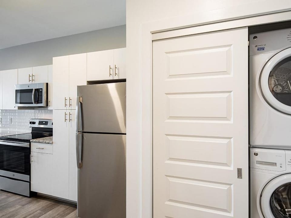 Kitchen or kitchenette, oven, stove, washing machine, dryer