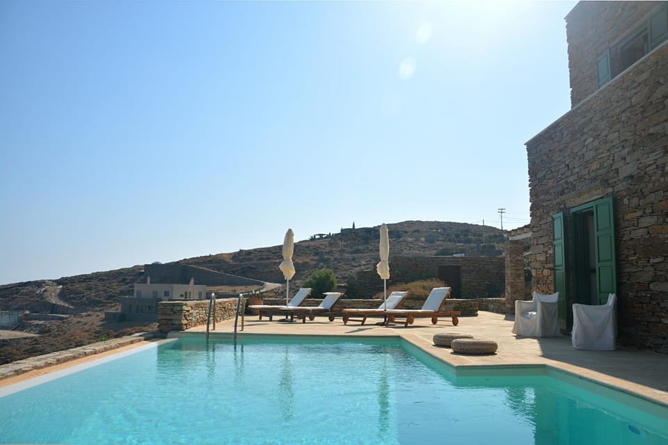 Property building, Patio, Natural landscape, Pool view, Swimming pool, sunbed