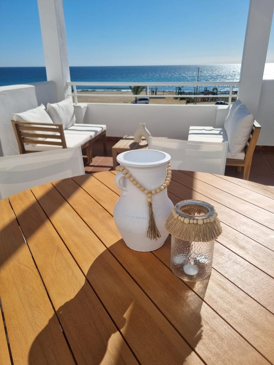 Patio, Natural landscape, View (from property/room), Living room, Dining area, Beach, Sea view
