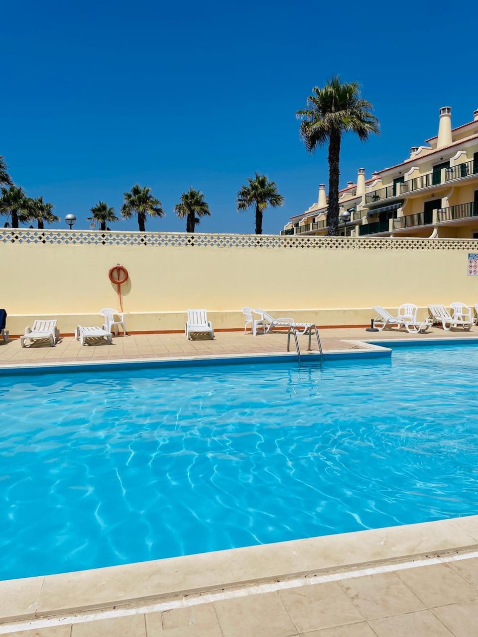 Swimming pool, sunbed