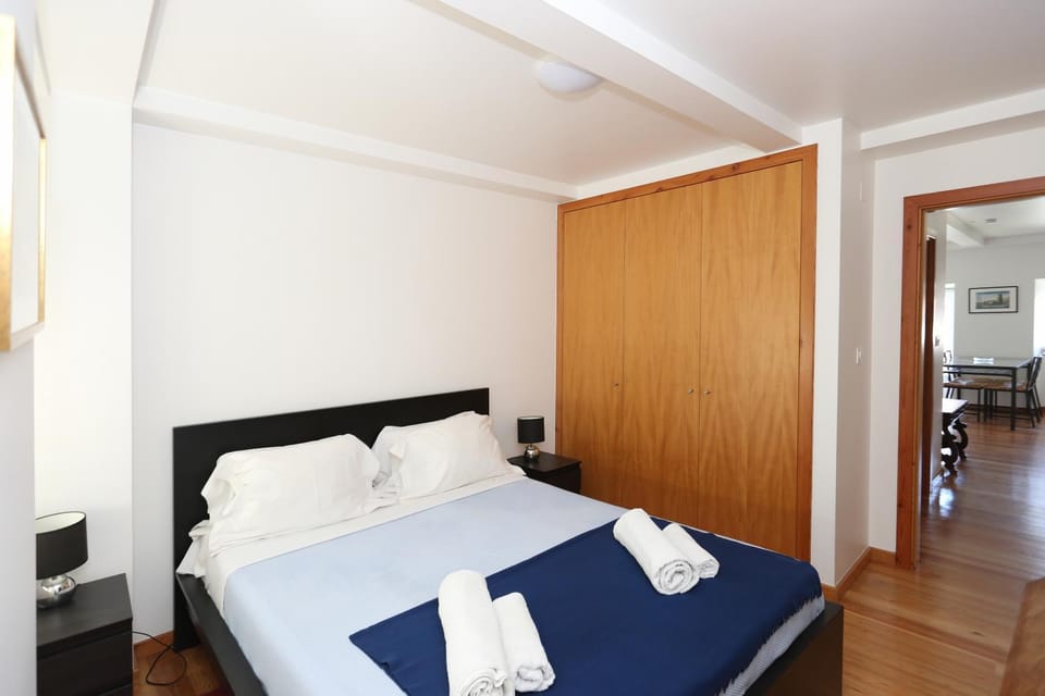 Bed, towels, wardrobe