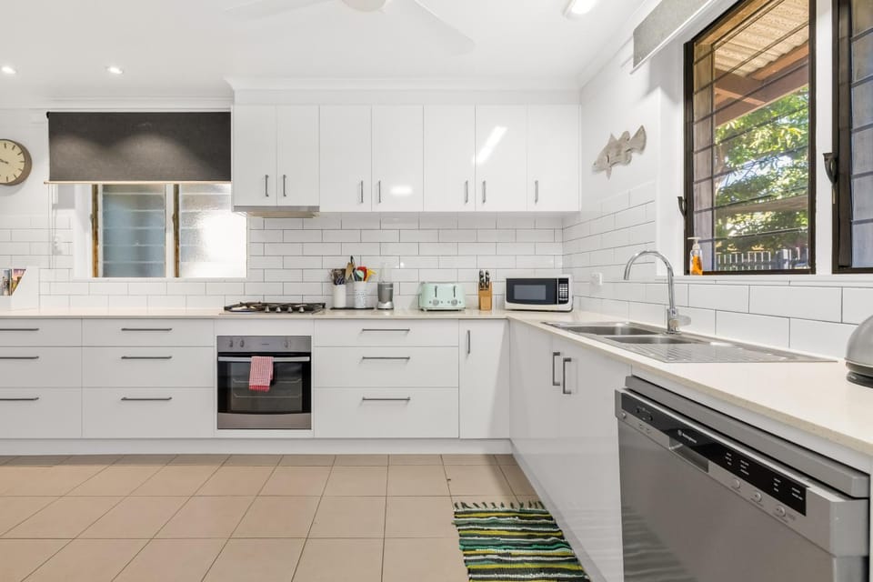 Kitchen or kitchenette, dishwasher, oven, stove, toaster
