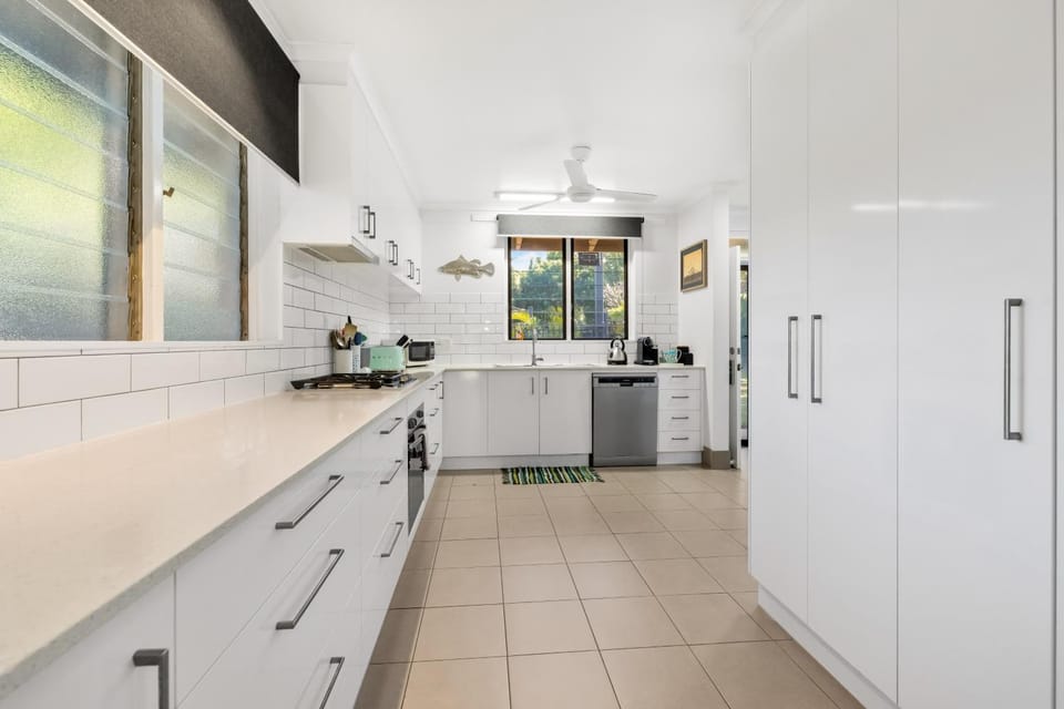 Kitchen or kitchenette, dishwasher, oven, stove