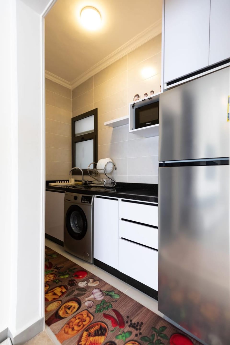 Kitchen or kitchenette, washing machine