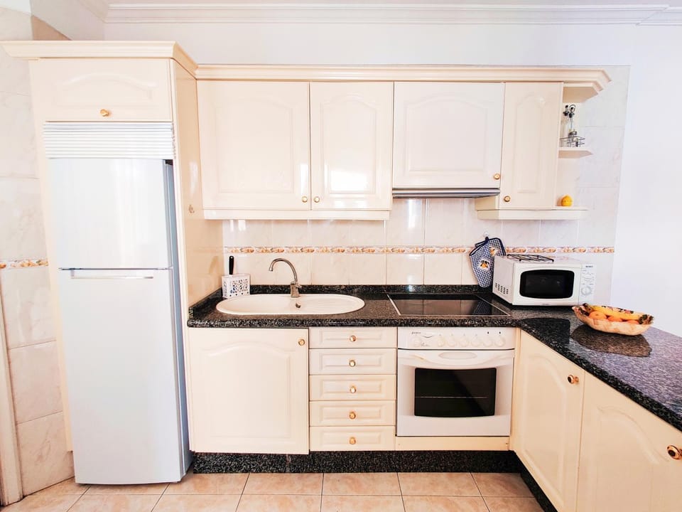 Kitchen or kitchenette, oven, stove