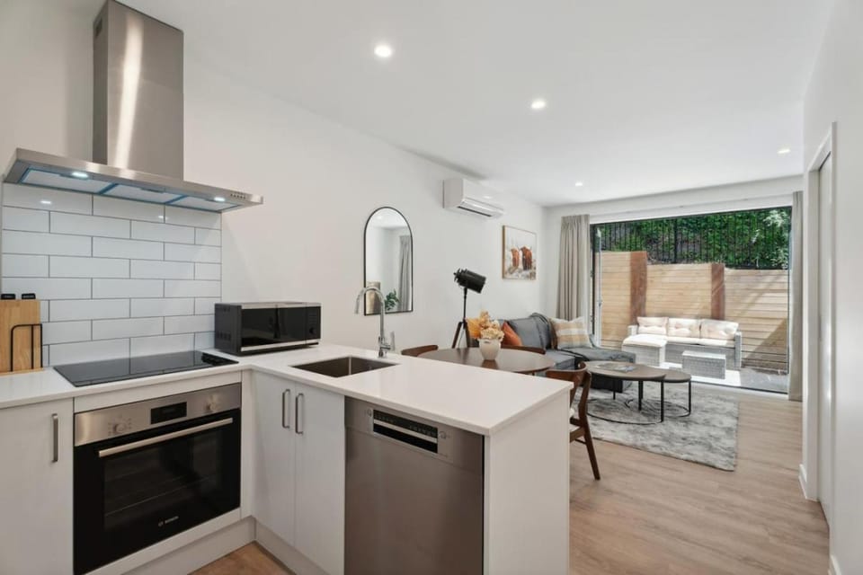 Kitchen or kitchenette, dishwasher, oven, stove