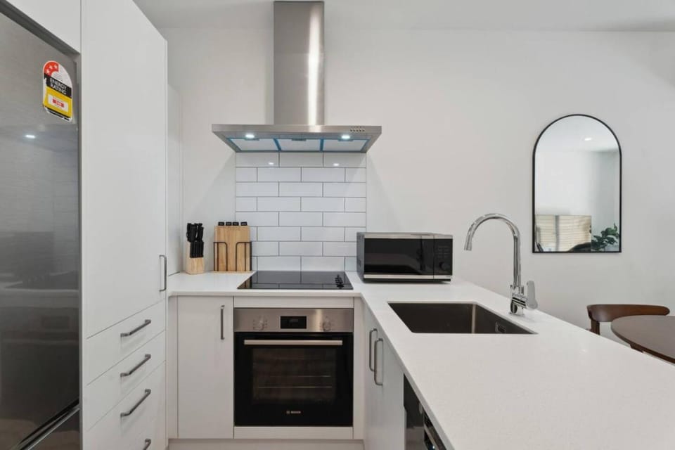 Kitchen or kitchenette, dishwasher, oven, stove