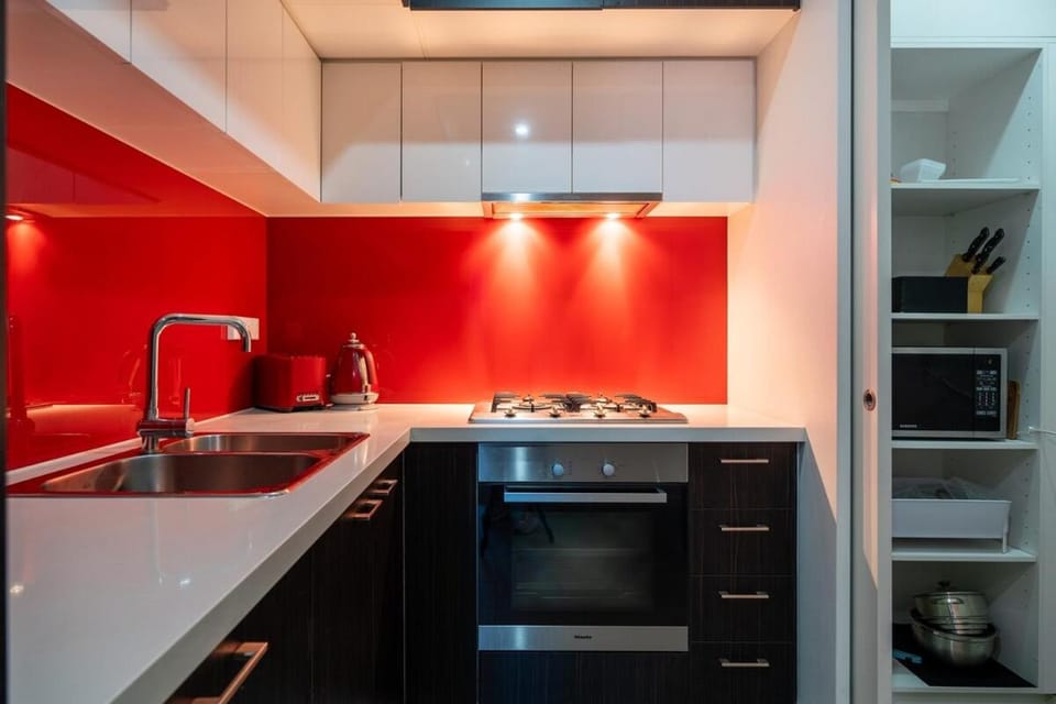 Kitchen or kitchenette, dishwasher, oven, stove