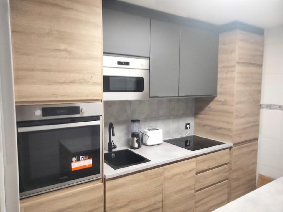 Kitchen or kitchenette, stove, toaster