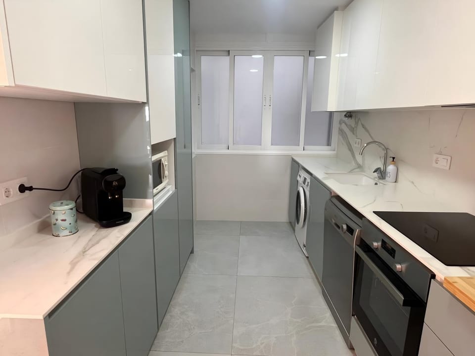 Kitchen or kitchenette, dishwasher, microwave, oven, stove, washing machine