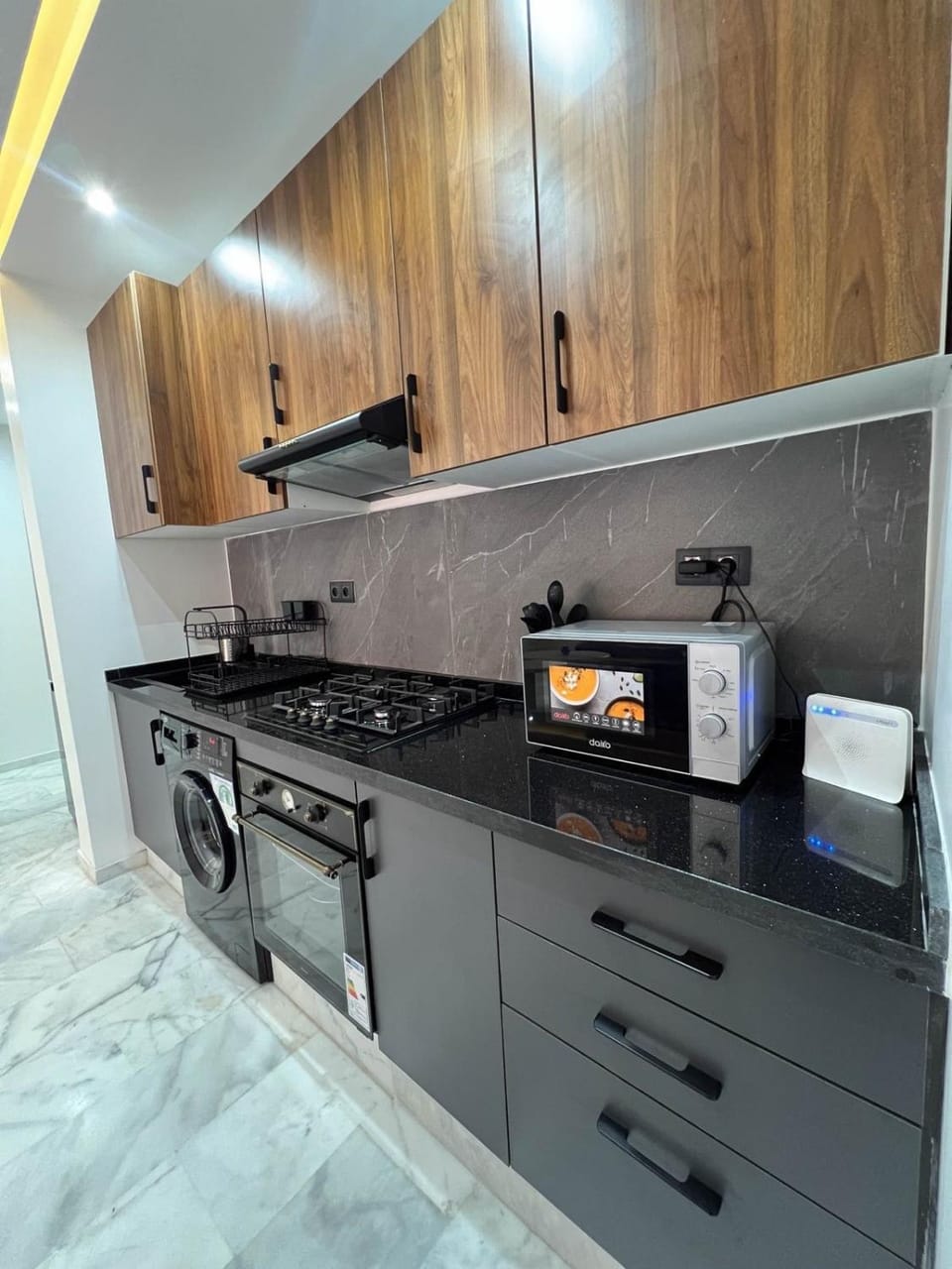 Kitchen or kitchenette, stove, washing machine