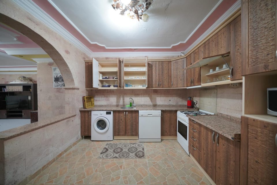 Kitchen or kitchenette, dishwasher, oven, stove, washing machine