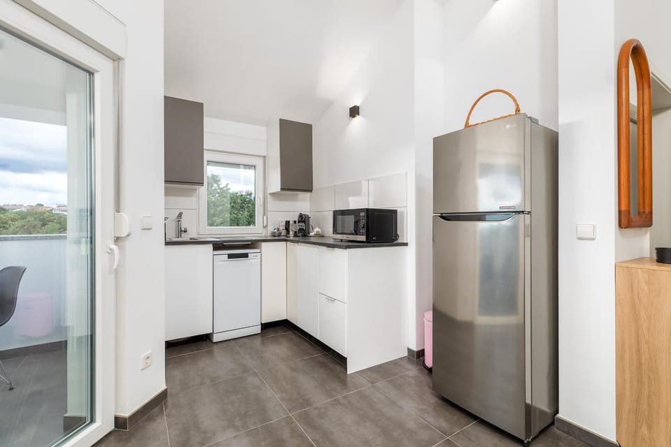 Kitchen or kitchenette, dishwasher, stove, toaster