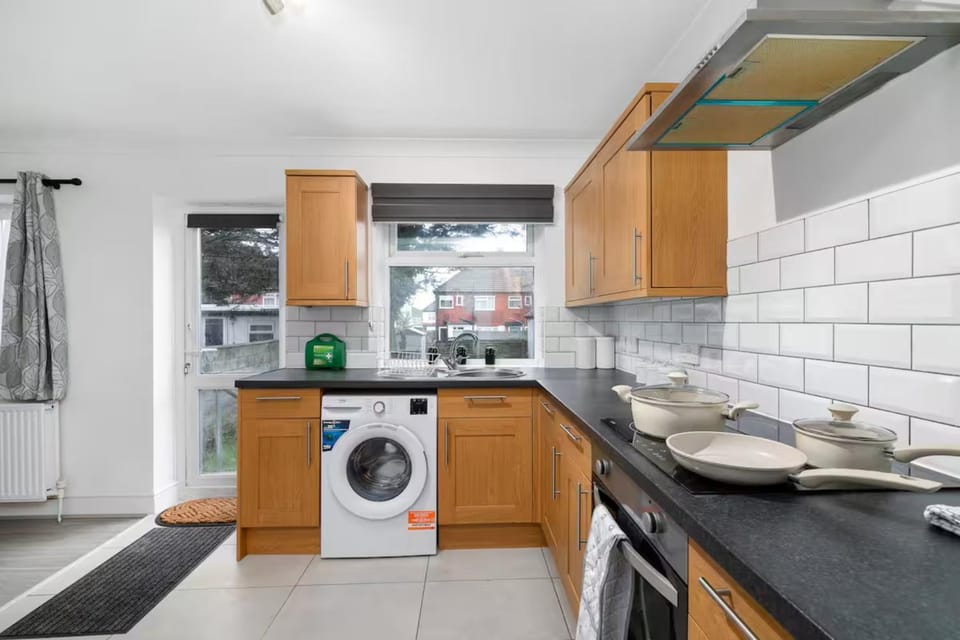 Garden view, oven, stove, washing machine, kitchen