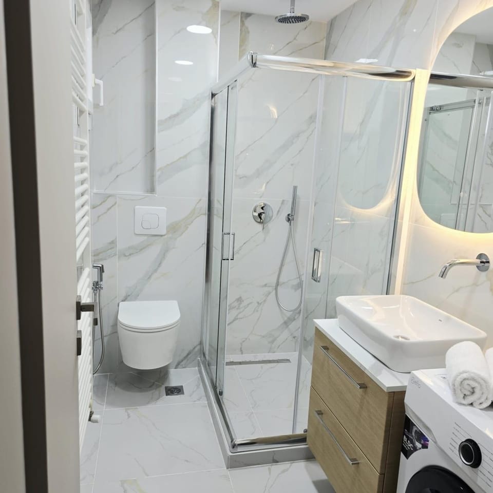 Shower, Toilet, Bathroom, towels, washing machine, dryer