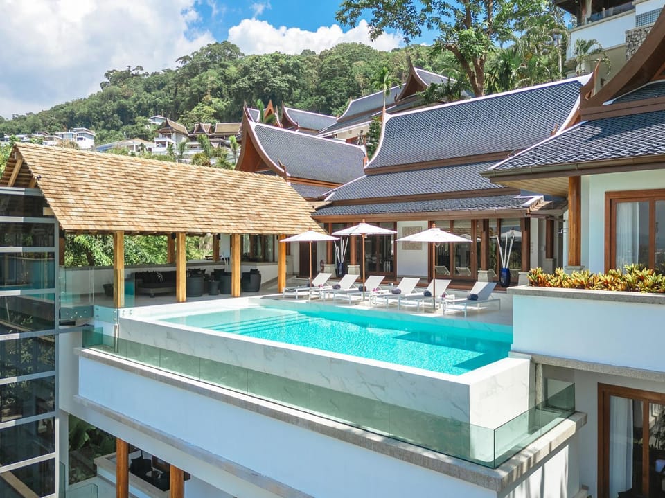 Property building, Patio, Day, Natural landscape, Pool view, Swimming pool, sunbed