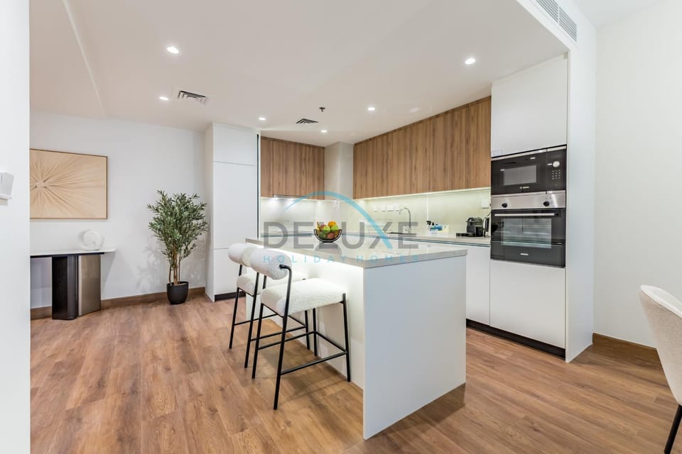 Kitchen or kitchenette, dishwasher, oven, stove