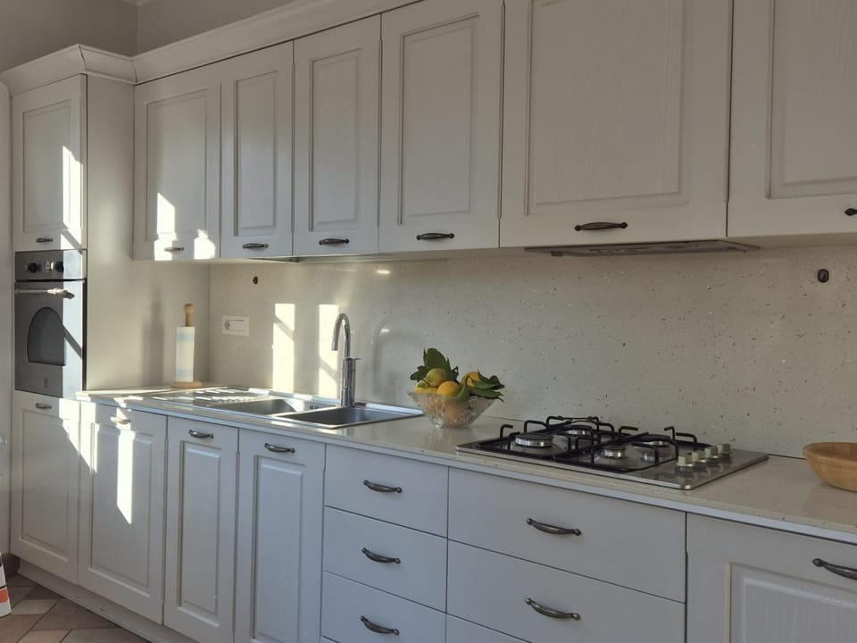 Kitchen or kitchenette, dishwasher, oven, stove