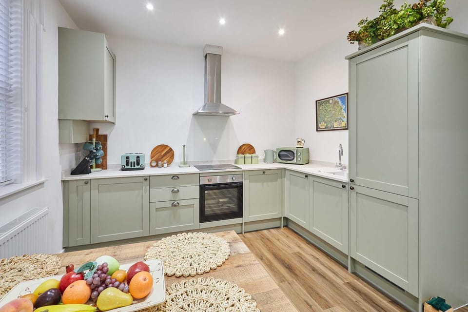 Kitchen or kitchenette, dishwasher, oven, stove