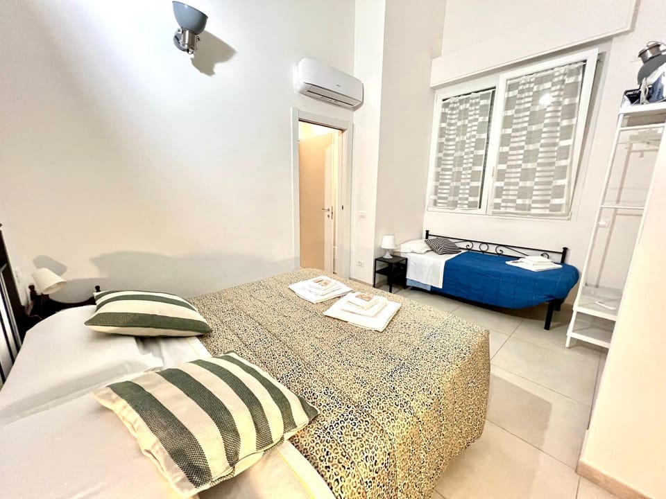 Bed, Photo of the whole room, Bedroom, towels, air conditioner