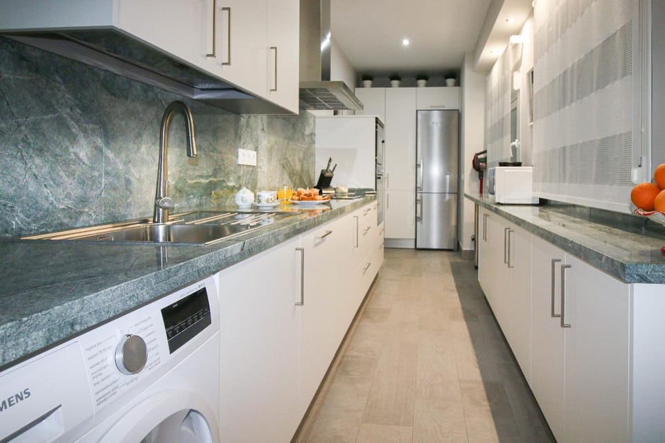 Kitchen or kitchenette, stove, washing machine