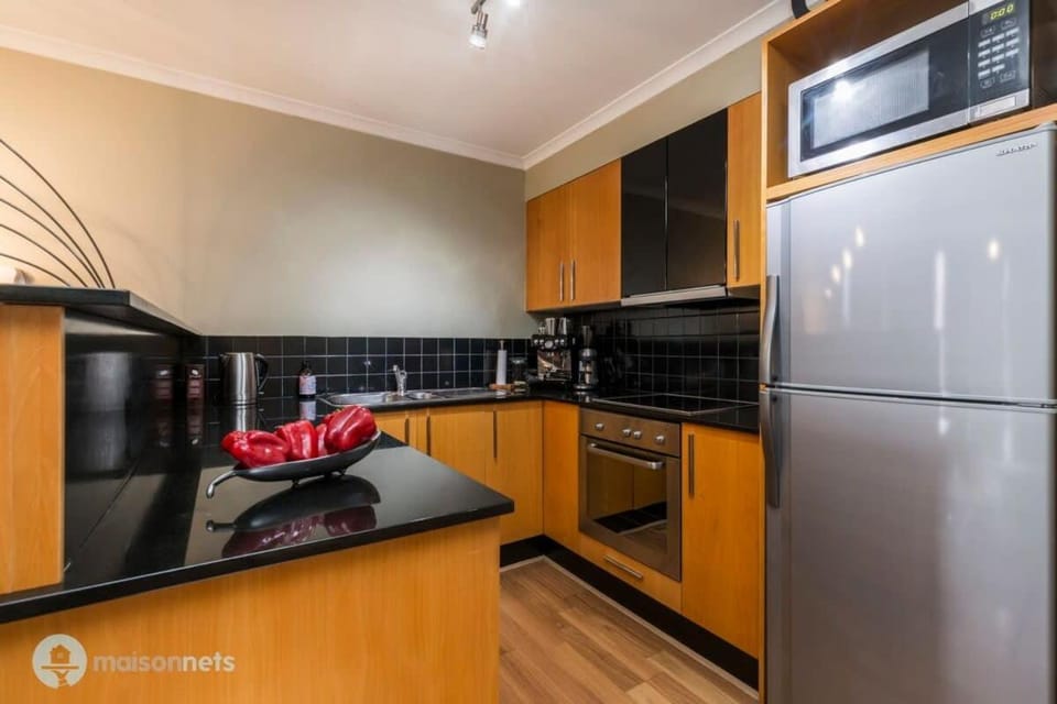 Kitchen or kitchenette, dishwasher, oven, stove
