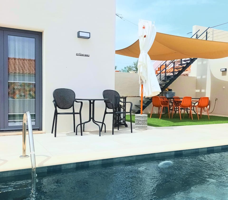 Property building, Patio, Day, View (from property/room), Balcony/Terrace, Living room, Seating area, Dining area, Pool view, Swimming pool, sunbed