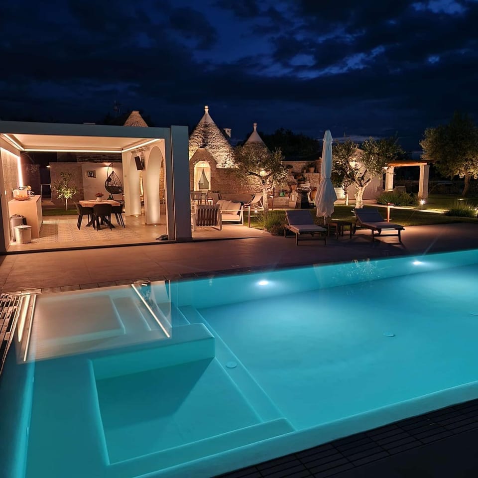 Property building, Patio, Night, Pool view, Swimming pool, sunbed
