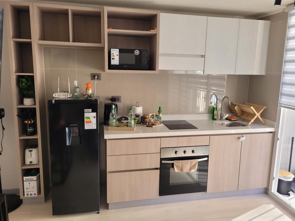Kitchen or kitchenette, oven, toaster