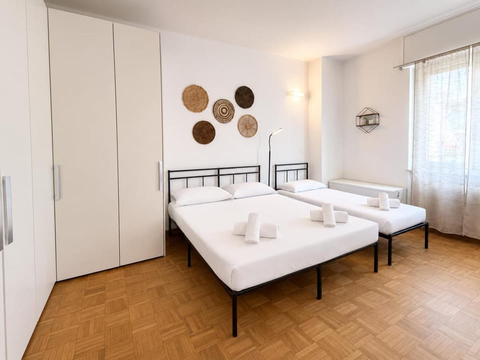 Bed, towels, wardrobe