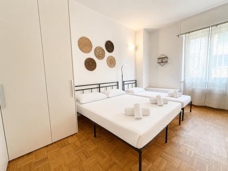 Bed, towels, wardrobe
