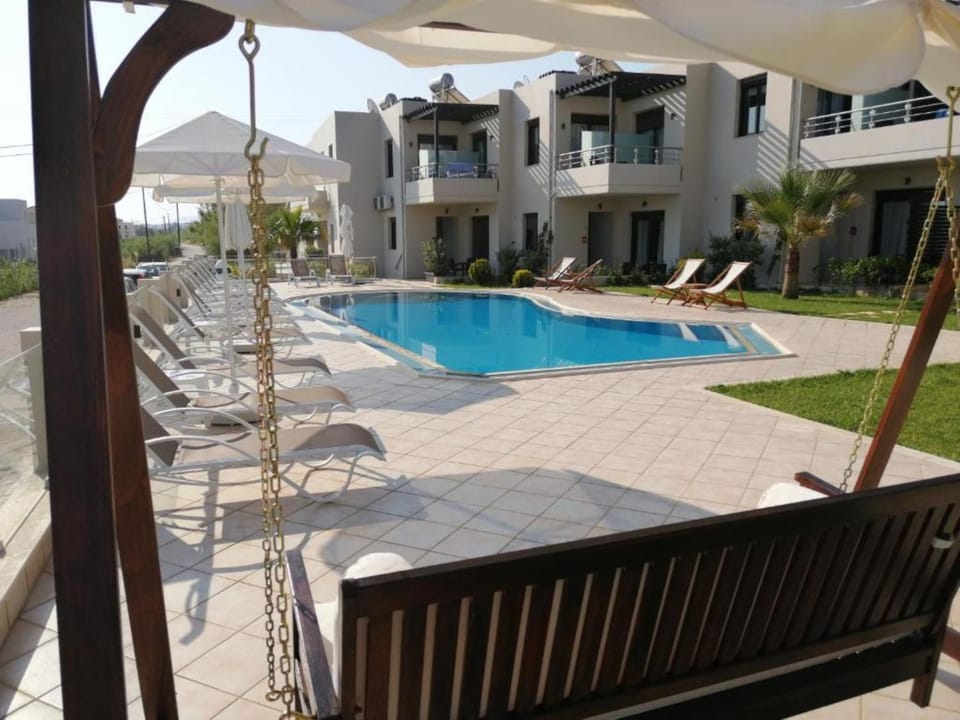 Property building, Patio, Pool view, Swimming pool, sunbed