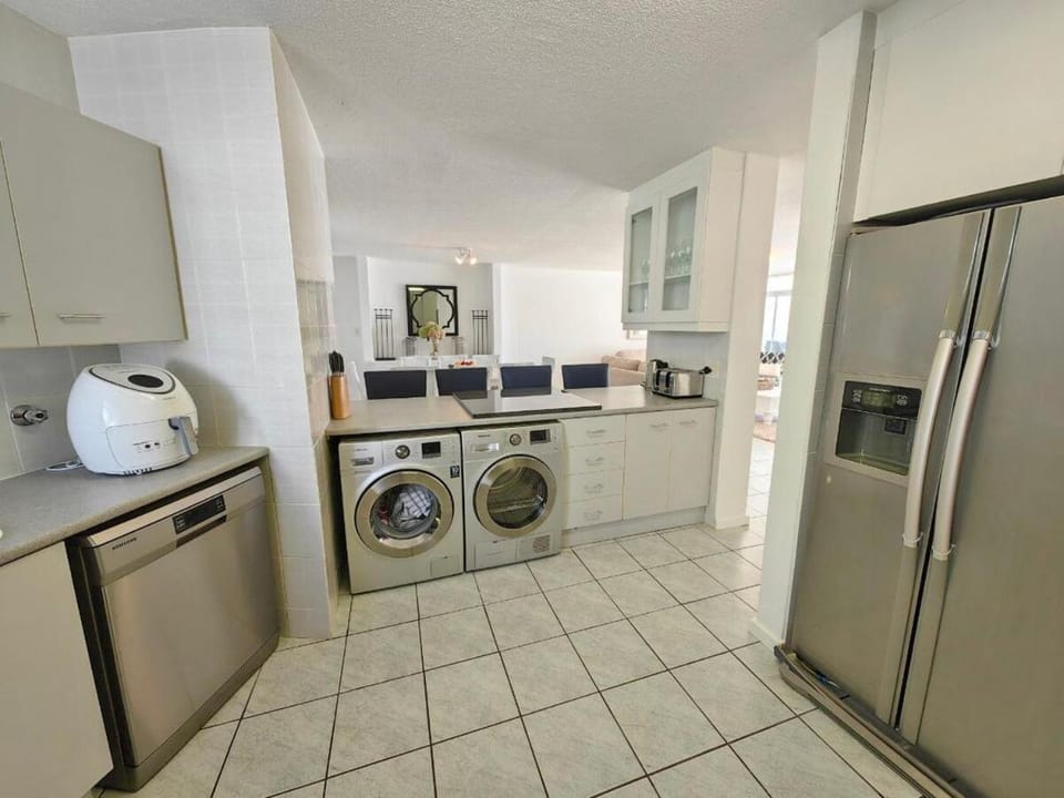 Kitchen or kitchenette, dishwasher, washing machine, dryer