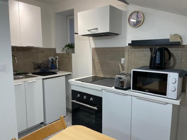 Kitchen or kitchenette, oven, stove, toaster