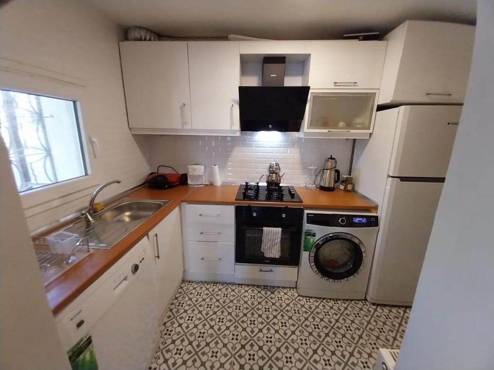 Kitchen or kitchenette, dishwasher, oven, stove, washing machine