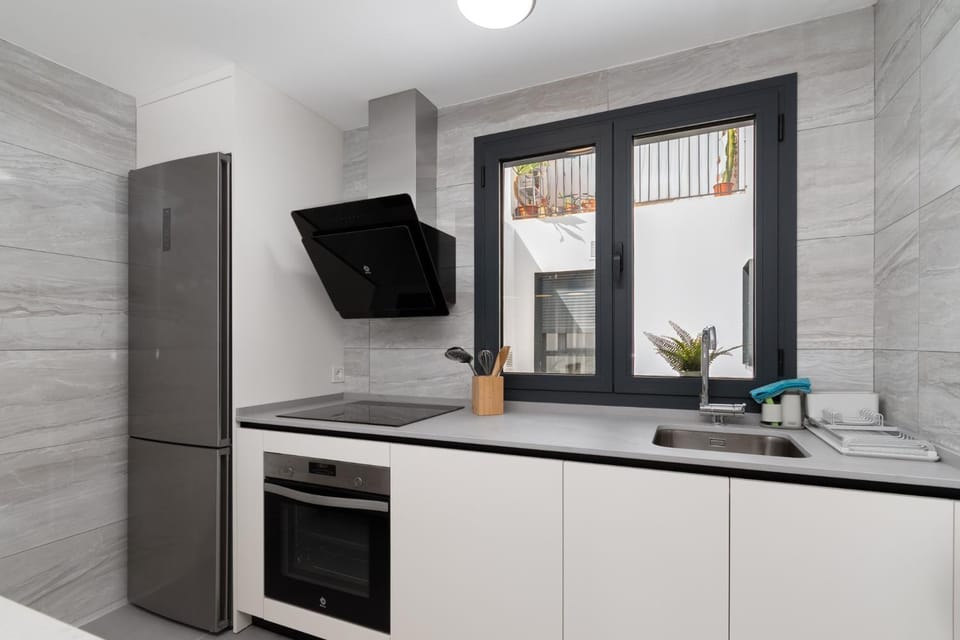 Kitchen or kitchenette, dishwasher, oven, stove