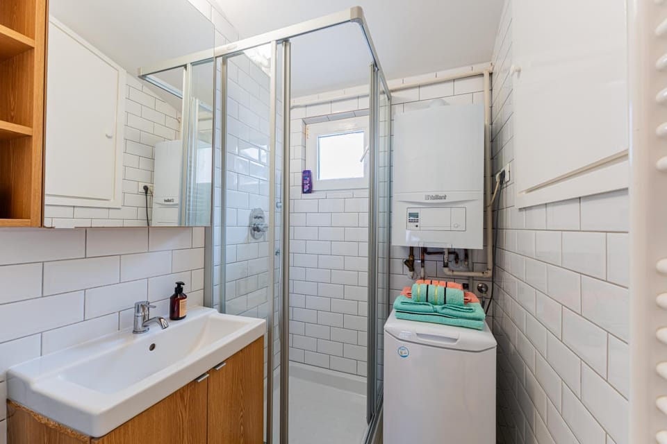 Shower, Toilet, Bathroom, towels, washing machine, dryer