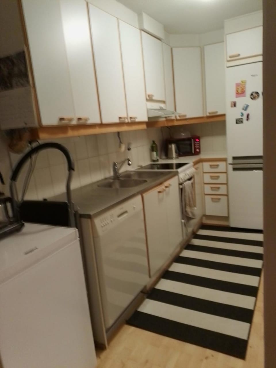Kitchen or kitchenette, dishwasher, oven, stove