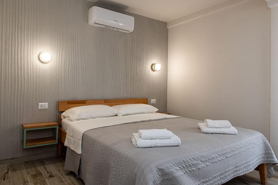 Bed, Photo of the whole room, Bedroom, towels, air conditioner