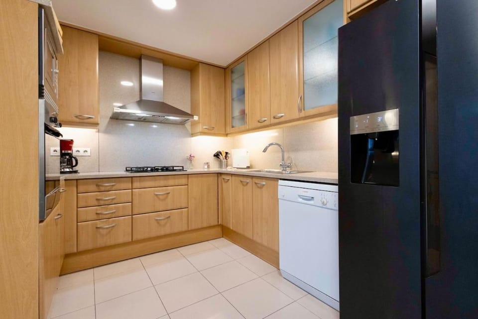 Kitchen or kitchenette, dishwasher, oven, stove