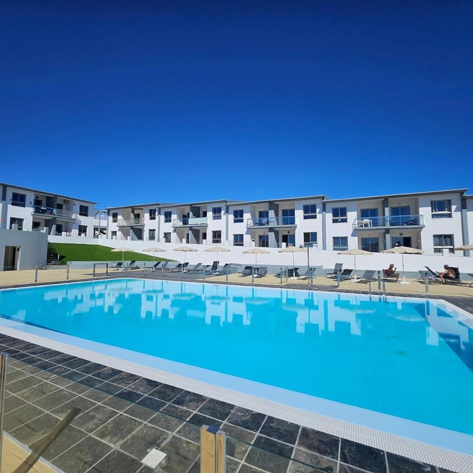 Property building, Pool view, Swimming pool, sunbed