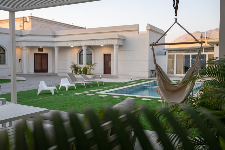 Property building, Patio, Natural landscape, Garden, Pool view, Swimming pool