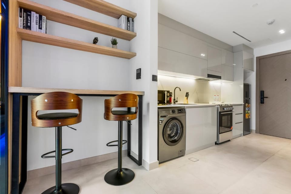 Kitchen or kitchenette, dishwasher, oven, stove, toaster, washing machine