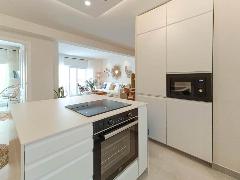 Kitchen or kitchenette, dishwasher, microwave, oven, stove, toaster