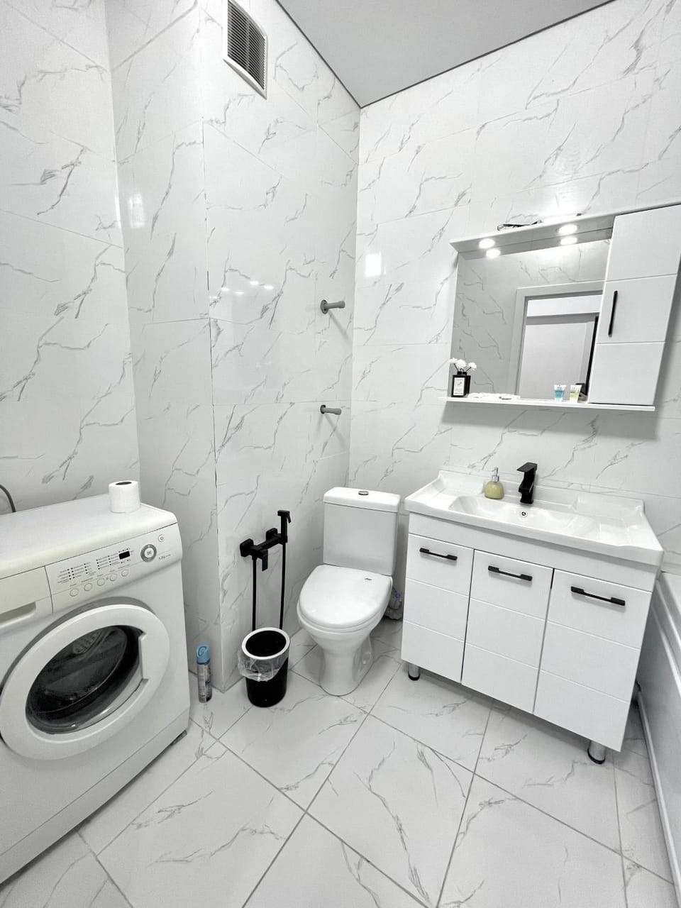 Toilet, Bathroom, towels, washing machine, dryer
