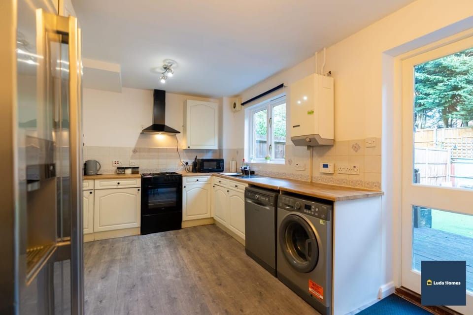 Kitchen or kitchenette, dishwasher, oven, stove, washing machine, dryer