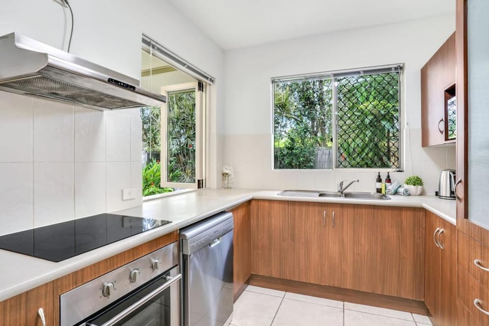 Kitchen or kitchenette, dishwasher, oven, stove