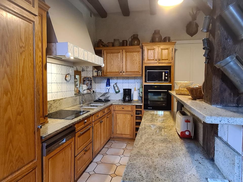 Kitchen or kitchenette, dishwasher, oven, stove, toaster